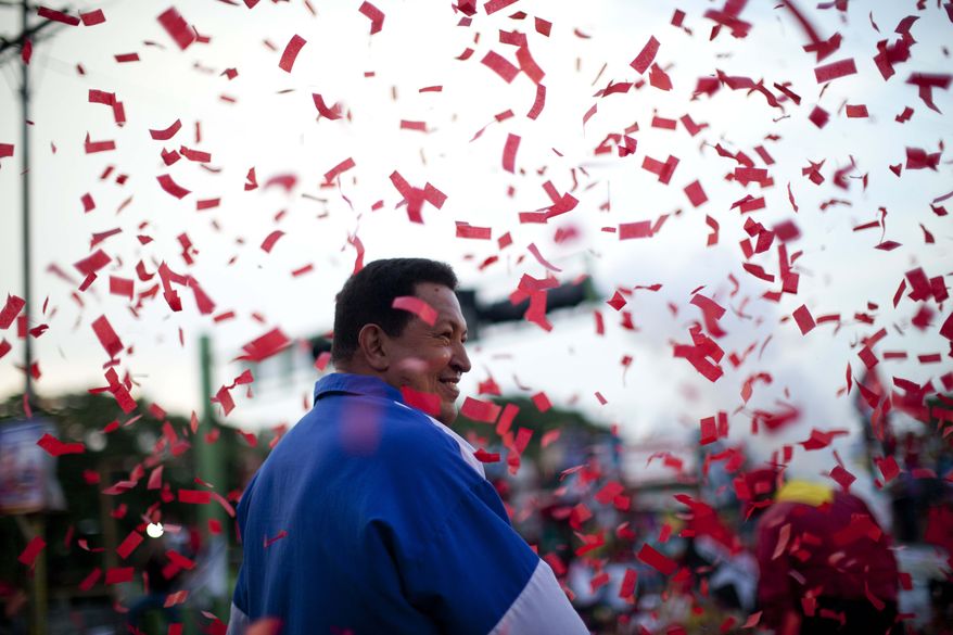 Venezuela's President Hugo Chavez smiles Oct. 3, 2012, during a campaign rally in Valencia, Venezuela. Chavez is running for re-election against opposition candidate Henrique Capriles in presidential elections on Oct. 7. (Associated Press)