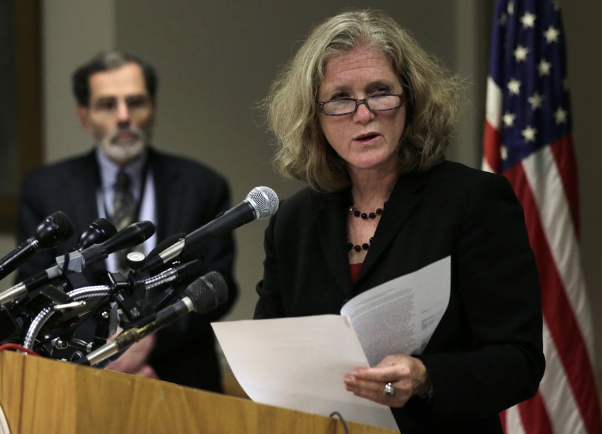 Dr. Madeleine Biondolillo, director of the Massachusetts Bureau of Healthcare Safety, answers a reporter's question on Thursday, Oct. 4, 2012, during a news conference in Boston regarding a meningitis outbreak linked to medicine from a Massachusetts specialty pharmacy. At rear left is Dr. Al DeMaria, the state epidemiologist. (Associated Press)
