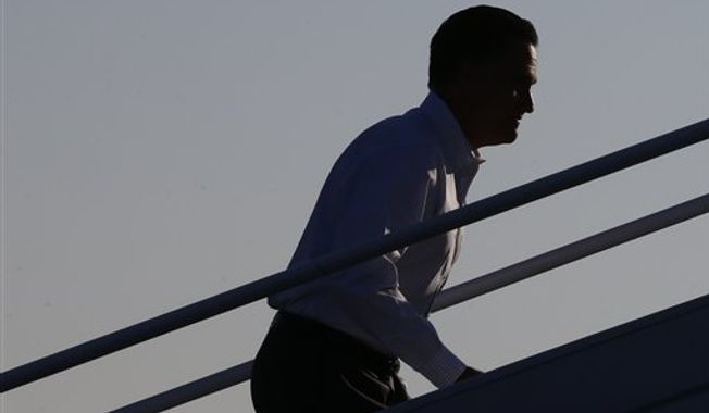 Republican presidential candidate and former Massachusetts Gov. Mitt Romney boards his campaign plane at Weyers Cave-Shenandoah Valley Airport in Weyers Cave, Va., Friday, Oct. 5, 2012. (AP Photo/Charles Dharapak)