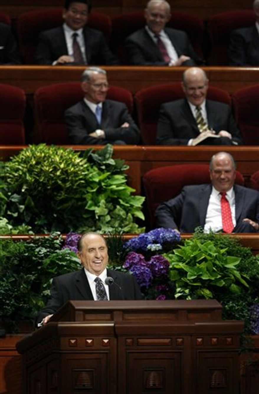 Mormon church President Thomas S. Monson speaks during the morning session of the 182nd Semiannual General Conference of the Church of Jesus Christ of Latter-day Saints in the Conference Center in Salt Lake City on Saturday, Oct. 6, 2012. Mr. Monson says the faith will lower its minimum age requirement for missionaries from 19 to 18 for men and from 21 to 19 for women. (AP Photo/The Deseret News, Laura Seitz)