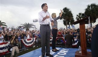 Republican presidential candidate and former Massachusetts Gov. Mitt Romney campaigns with wife Ann in St. Petersburg, Fla., Friday, Oct. 5, 2012. (AP Photo/Charles Dharapak)