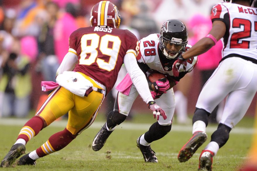 Atlanta Falcons free safety Thomas DeCoud (28) intercepts a pass in front of Washington Redskins wide receiver Santana Moss (89) to seal a Falcon victory at FedEx Field, Landover, Md., Oct. 10, 2012. (Preston Keres/Special to The Washington Times)