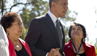 President Obama walks with Cesar Chavez&#39;s widow, Helen F. Chavez (left), and Dolores Huerta, co-founder of the United Farm Workers, as they tour the Cesar E. Chavez National Monument Memorial Garden in Keene, Calif., on Monday. (Associated Press)