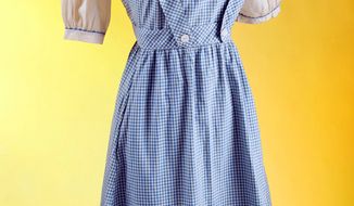 This photo provided by Julien&#39;s Auctions shows the original costume worn by Judy Garland in the film &quot;The Wizard of Oz.&quot; (Associated Press/Julien&#39;s Auctions)
