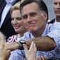 Republican presidential candidate Mitt Romney and his wife, Ann, campaign at Tradition Town Square in Port St. Lucie, Fla., on Sunday, Oct. 7, 2012. (AP Photo/Charles Dharapak)
