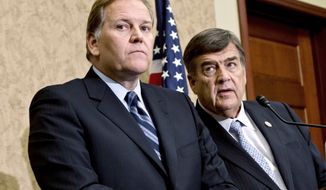 ** FILE ** Rep. Mike Rogers (left), Michigan Republican, who is House Intelligence Committee chairman, and Rep. C.A. Dutch Ruppersberger, Maryland Democrat, who is his party&#39;s ranking member on the panel, confer on Monday, Oct. 8, 2012, after releasing a report on an 11-month probe of China’s two leading technology firms, Huawei Technologies Ltd. and ZTE Corp. The report warns that the two telecommunications makers pose a major security threat to the U.S. (Associated Press)