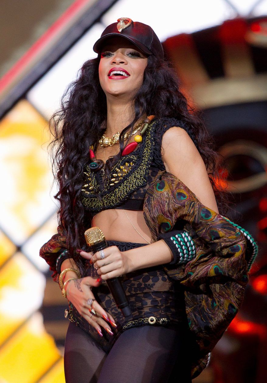 Barbados-born singer Rihanna performs on stage at the 2012 Wireless Music Festival in Hyde Park, central London, Sunday, July 8, 2012. (AP Photo/Joel Ryan)