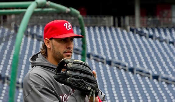 Washington Nationals player Michael Morse takes to the field for a workout session at Nationals Park on Tuesday, Oct. 9, 2012. On Wednesday, they play the St. Louis Cardinals at home. (Barbara L. Salisbury/The Washington Times)