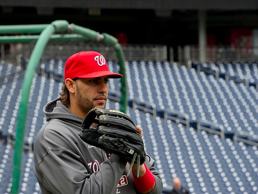 Washington Nationals player Michael Morse takes to the field for a workout session at Nationals Park on Tuesday, Oct. 9, 2012. On Wednesday, they play the St. Louis Cardinals at home. (Barbara L. Salisbury/The Washington Times)