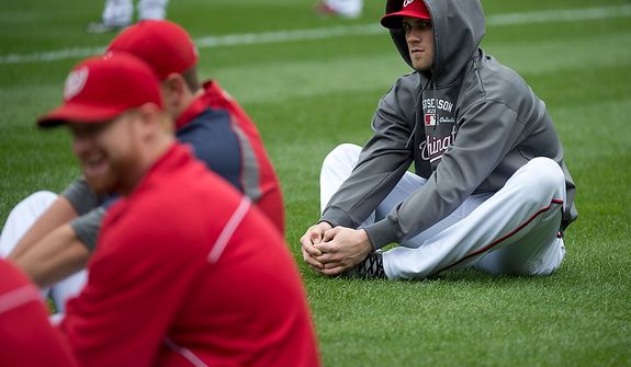 Washington Nationals player Bryce Harper stretches with his teammates at Nationals Park on Tuesday, Oct. 9, 2012. On Wednesday, they play the St. Louis Cardinals at home. (Barbara L. Salisbury/The Washington Times)