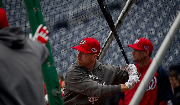 Washington Nationals first baseman Adam LaRoche hits the ball during batting practice at Nationals Park on Tuesday, Oct. 9, 2012. On Wednesday, they play the St. Louis Cardinals at home. (Barbara L. Salisbury/The Washington Times)