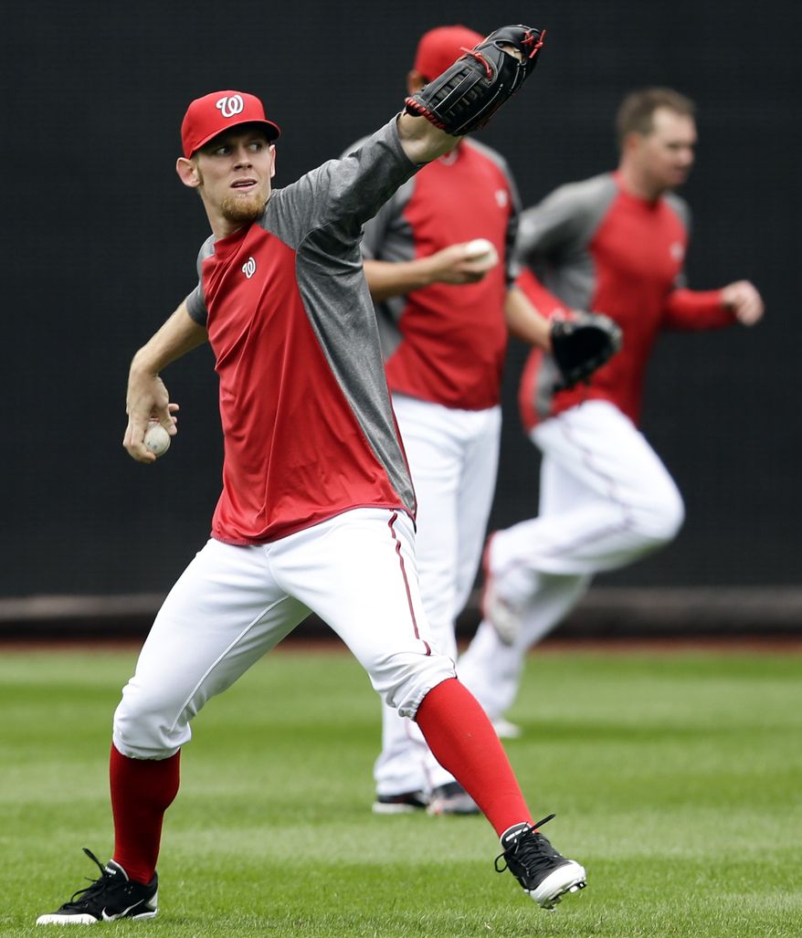 Washington Nationals pitcher Stephen Strasburg throws during batting practice at Nationals Park, Tuesday, Oct. 9, 2012, in Washington. The Nationals are scheduled to host the St. Louis Cardinals in Game 3 of the National League division series on Wednesday. The best-of-five games series is tied 1-1. (AP Photo/Alex Brandon)