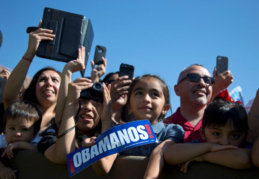 Members of the audience look to the stage as President Obama speaks at the Cesar E. Chavez National Monument on Monday, Oct. 8, 2012, in Keene, Calif. (AP Photo/Carolyn Kaster)