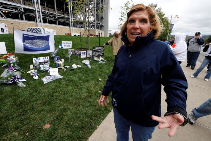 **FILE** Gayle Barnes, a member of the jury that convicted former Penn State assistant football coach Jerry Sandusky, stands Oct. 6, 2012, outside Beaver Stadium in State College, Pa. Sandusky was convicted in June of molesting several boys over a period of years. Barnes, a homemaker and former school district employee, said she thinks a lot about the victims, particularly the eight who testified against Sandusky and provided what she considers the critical evidence of guilt. She said he deserves life in prison. (Associated Press)