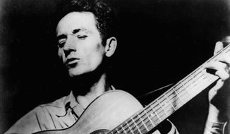 Woody Guthrie’s protest songs are memorable because he “was able to impart the human experience of the people,” says a historian. (Associated Press)