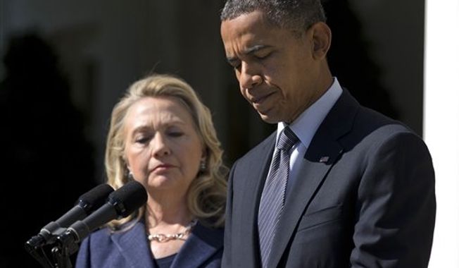 ** FILE ** In this Sept. 12, 2012, photo, President Barack Obama, accompanied by Secretary of State Hillary Rodham Clinton, speaks in the Rose Garden of the White House in Washington, about the death of U.S. ambassador to Libya Christopher Stevens. (AP Photo/Evan Vucci) 