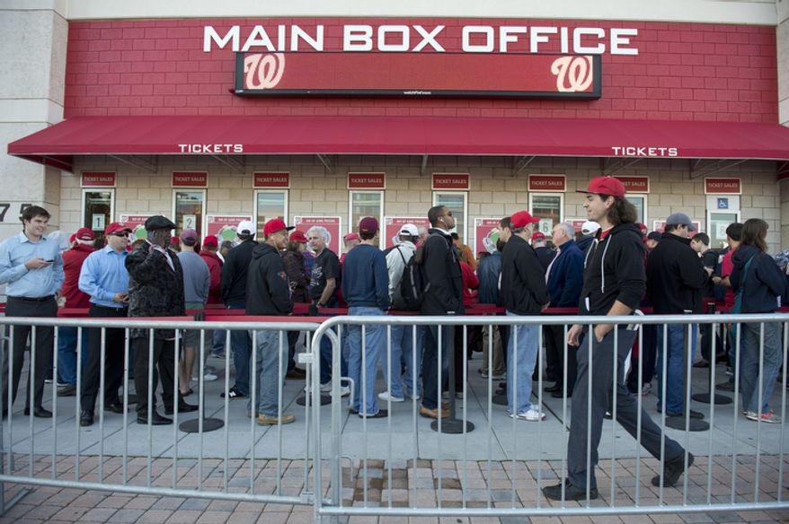 Washington Nationals fans wait in line to buy tickets to the Nats' first home playoff game on Wednesday, Oct. 10, 2012. Standing-room-only seats were being sold for $30 each, and 829 tickets were available for purchase. (Barbara L. Salisbury/The Washington Times)