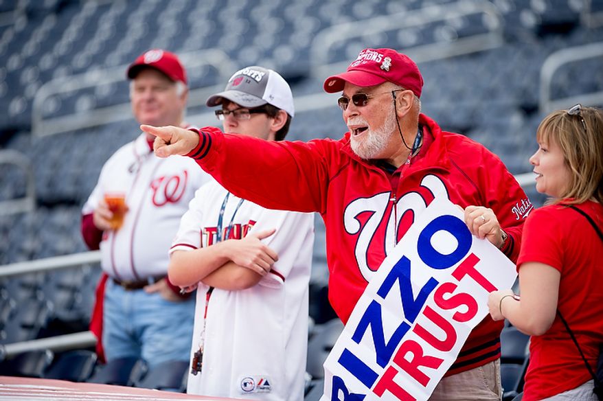 Fans watch warm-ups before the Washington Nationals play the St. Louis Cardinals in game three of the National League Division Series at Nationals Park in Washington on Wednesday, Oct. 10, 2012. (Andrew Harnik/The Washington Times)