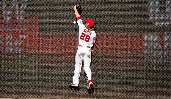 Washington Nationals right fielder Jayson Werth (28) misses a catch against the wall in the sixth inning hit by St. Louis Cardinals third baseman David Freese (23) as the Washington Nationals play the St. Louis Cardinals in game three of the National League Division Series at Nationals Park, Washington, D.C., Wednesday, October 10, 2012. (Andrew Harnik/The Washington Times)