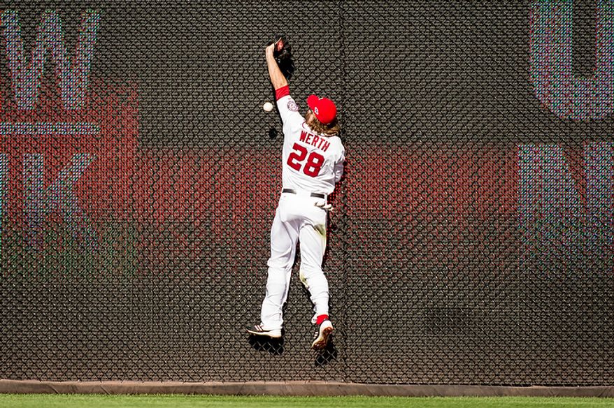Washington Nationals right fielder Jayson Werth (28) misses a catch against the wall in the sixth inning hit by St. Louis Cardinals third baseman David Freese (23) as the Washington Nationals play the St. Louis Cardinals in game three of the National League Division Series at Nationals Park, Washington, D.C., Wednesday, October 10, 2012. (Andrew Harnik/The Washington Times)