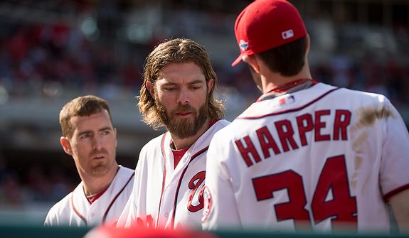 Left to right: Washington Nationals first baseman Adam LaRoche (25), right fielder Jayson Werth (28), and center fielder Bryce Harper (34), get ready to take the field for the top of the sixth inning as the Washington Nationals play the St. Louis Cardinals in game three of the National League Division Series at Nationals Park, Washington, D.C., Wednesday, October 10, 2012. (Andrew Harnik/The Washington Times)