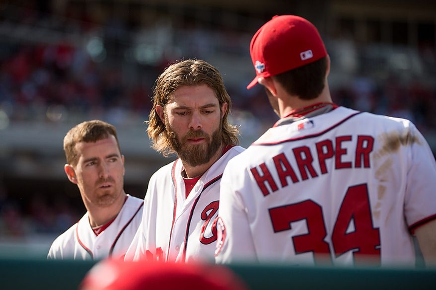 Left to right: Washington Nationals first baseman Adam LaRoche (25), right fielder Jayson Werth (28), and center fielder Bryce Harper (34), get ready to take the field for the top of the sixth inning as the Washington Nationals play the St. Louis Cardinals in game three of the National League Division Series at Nationals Park, Washington, D.C., Wednesday, October 10, 2012. (Andrew Harnik/The Washington Times)
