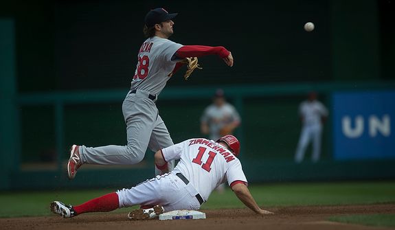 Nationals&#39; Ryan Zimmerman is tagged in a force out at second base by Cardinals&#39; Pete Kozma in the bottom of the first inning as the Washington Nationals host the St. Louis Cardinals for Game 3 of the National League Division Series at Nationals Park in Washington, D.C., Wednesday, Oct. 10, 2012. (Rod Lamkey Jr./The Washington Times)