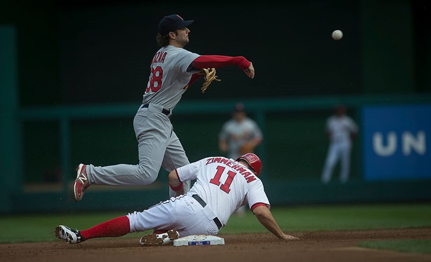 Nationals' Ryan Zimmerman is tagged in a force out at second base by Cardinals' Pete Kozma in the bottom of the first inning as the Washington Nationals host the St. Louis Cardinals for Game 3 of the National League Division Series at Nationals Park in Washington, D.C., Wednesday, Oct. 10, 2012. (Rod Lamkey Jr./The Washington Times)