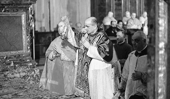 Pope Paul VI incenses the altar of the Basilica of Saint Mary Major in Rome during a solemn religious ceremony on the first anniversary of the opening of the Roman Catholic Ecumenical Council, Oct. 11, 1963.  About 2,000 of the 2,500 Council Fathers gathered for the second session of the Council, attended the ceremony.  (AP Photo/Girolamo Di Majo)
