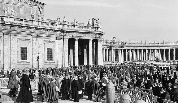 Council fathers leave St. Peter&#39;s Basilica in Vatican City, Dec. 2, 1963 at the conclusion of the final working session of the current Ecumenical Council.  Pope Paul VI sent word to the Council that he would issue an apostolic letter on December 3, extending new powers to all bishops. (AP Photo)