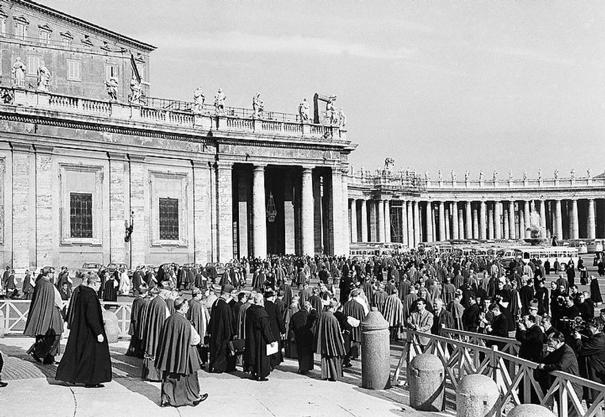 Council fathers leave St. Peter's Basilica in Vatican City, Dec. 2, 1963 at the conclusion of the final working session of the current Ecumenical Council. Pope Paul VI sent word to the Council that he would issue an apostolic letter on December 3, extending new powers to all bishops. (AP Photo)