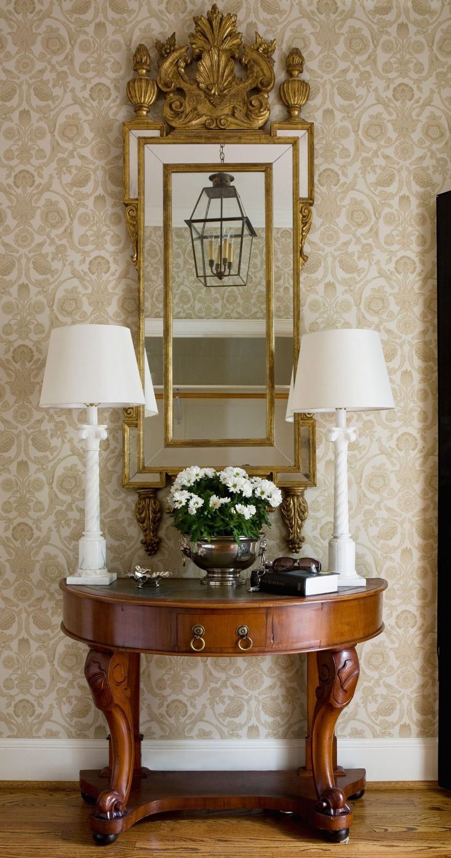 Photograph provided by Angie Seckinger
In a foyer that lacks natural lighting, table lamps can add welcoming light, says Kelley Proxmire of Kelley Interior Design in Bethesda. A mirror can be used to reflect additional light.