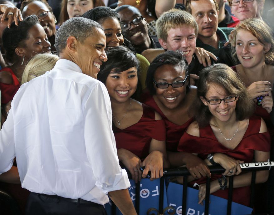 **FILE** President Obama stops for a photo with members of the Vox Harmonia Visual and Performing Arts Academy Salem High School during a Sept. 27, 2012, campaign event at Farm Bureau Live in Virginia Beach, Va. (Associated Press)