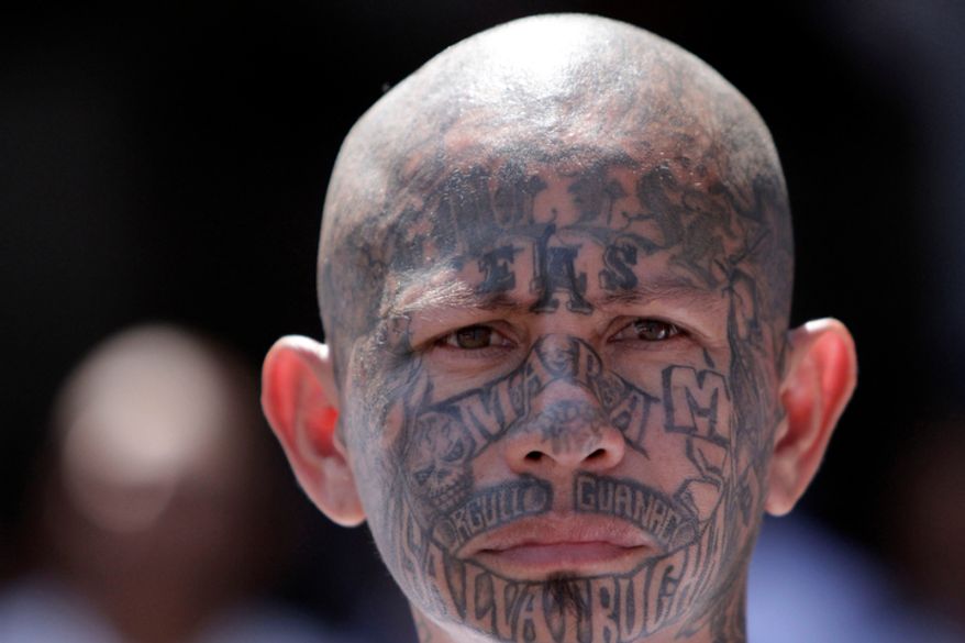 An inmate belonging to the Mara Salvatrucha, or MS-13, gang stands inside a prison in Ciudad Barrios, El Salvador, on March 26, 2012. (Associated Press) ** FILE **