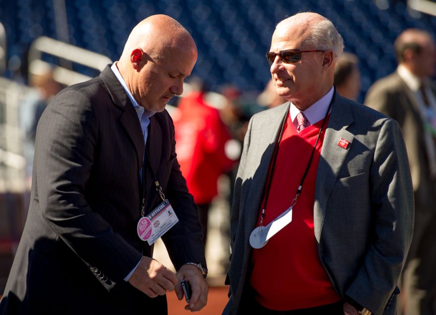 Washington Nationals General Manager Mike Rizo, left, talks with owner Mark Lerner, right, before the Washington Nationals play the St. Louis Cardinals in game four of the National League Division Series at Nationals Park, Washington, D.C., Thursday, October 11, 2012. (Andrew Harnik/The Washington Times)