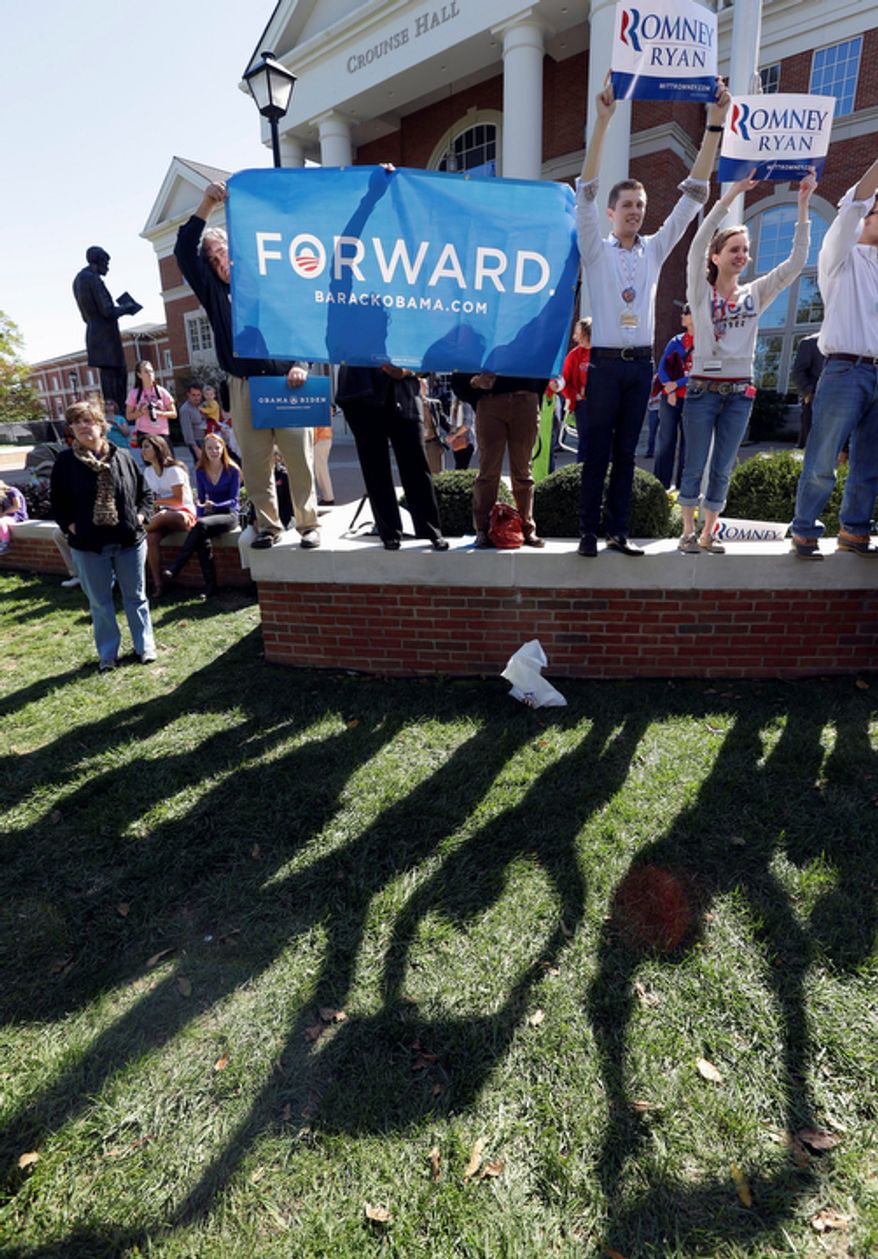 Supporters hold signs in support of President Obama and Republican presidential candidate Mitt Romney on Oct. 11, 2012, at Centre College, site of the vice presidential debate in Danville, Ky., later that day. Vice President Joseph R. Biden will face Republican vice presidential candidate Paul Ryan. (Associated Press)