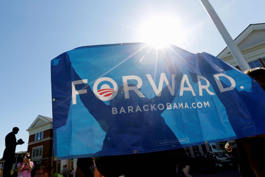 Supporters hold an Obama banner on Oct. 11, 2012, at Centre College in Danville, Ky., site of the vice presidential debate. Vice President Joseph R. Biden was to face Republican vice presidential candidate Paul Ryan later that day. (Associated Press)