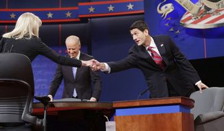 Moderator Martha Raddatz, left, reaches across to greet Republican vice presidential candidate, Rep. Paul Ryan, R-Wis., right, as Vice President Joe Biden, center, takes his seat for the start of the vice presidential debate. (AP Photo/Pablo Martinez Monsivais)