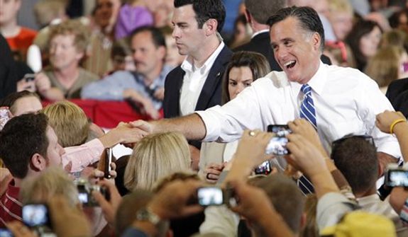 Republican presidential candidate, former Massachusetts Gov. Mitt Romney shakes hands with supporters at a campaign rally at the U.S. Cellular Center on Thursday, Oct. 11, 2012, in Asheville, N.C. (AP Photo/Matt Rose)