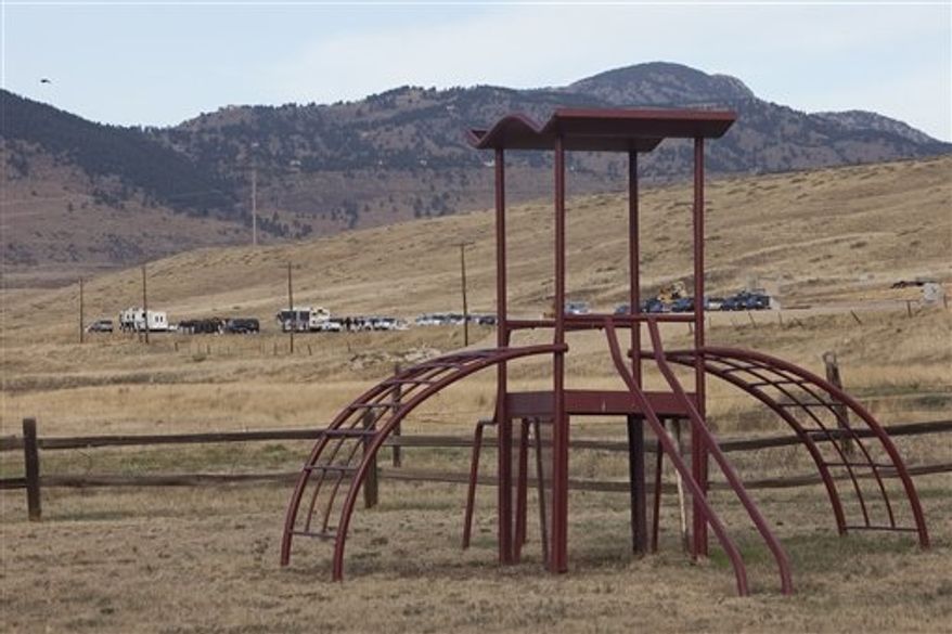 Police search near an area where a body was found Wednesday in Parttridge Park, in Arvada, Colo., during the ongoing search for missing 10-year-old Jessica Ridgeway on Thursday, Oct. 11, 2012. (AP Photo/Barry Gutierrez)