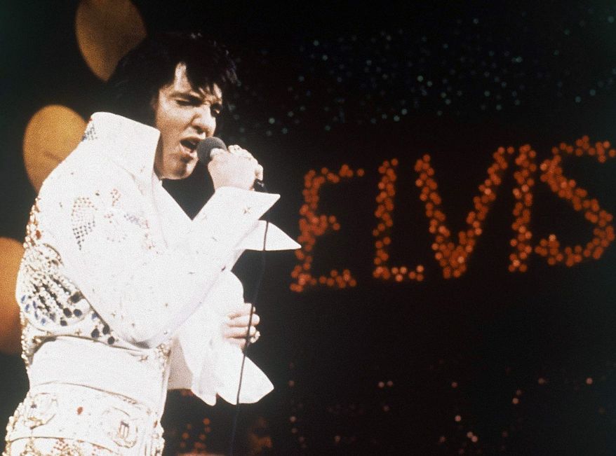 FILE - This 1972 file photo shows Elvis Presley, the King of Rock &quot;n&quot; Roll, during a performance. The former Beverly Hills home of the late Elvis Presley and his wife Priscilla is up for sale for a cool $12.9 million. Real estate website operator Trulia says the home hit the market Wednesday, Oct. 10, 2012. (AP Photo, file)
