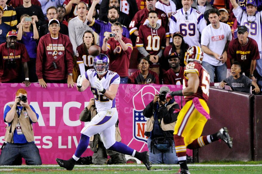 Minnesota Vikings tight end Kyle Rudolph (82) hauls in one-yard touchdown in the fourth quarter in front of Washington Redskins linebacker Keenan Robinson (52) at FedEx Field. (Preston Keres/Special to The Washington Times)
