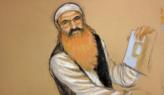 ** FILE ** In this photo of a sketch by courtroom artist Janet Hamlin and reviewed by the U.S. Department of Defense, Khalid Sheikh Mohammed holds up a piece of paper during a court recess Oct. 15, 2012, at his Military Commissions pretrial hearing in the Guantanamo Bay U.S. Naval Base in Cuba. (Associated Press)