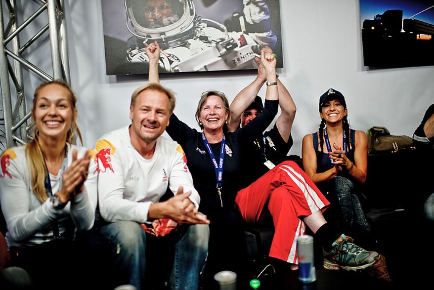 In this photo provided by Red Bull, family members and friends of pilot Felix Baumgartner celebrate his successful jump in Roswell, N.M., on Oct. 14, 2012. Baumgartner came down safely in the eastern New Mexico desert minutes about nine minutes after jumping from his capsule 128,097 feet, or roughly 24 miles, above Earth (Associated Press/Red Bull Stratos, Joerg Mitter)