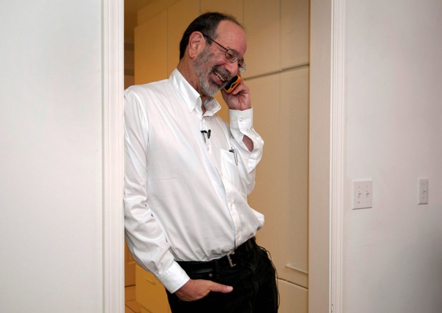 Alvin Roth, a Harvard University scholar who is a visiting professor at Stanford University, takes a phone call at his home in Menlo Park, Calif., on Monday, Oct. 15, 2012, after being awarded the Nobel economics prize. Mr. Roth, 60, and Lloyd Shapley, 89, two Americans, were awarded the Nobel for their studies on the matchmaking that takes place when doctors are coupled up with hospitals, students with schools and human organs with transplant recipients. The work of two has sparked a flourishing field of research and helped improve the performance of many markets, the Royal Swedish Academy of Sciences said. (AP Photo/Stanford News Service, Linda A. Cicero)