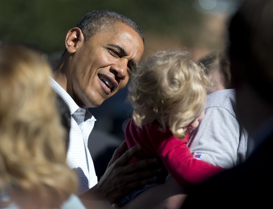President Obama greets supporters Oct. 14, 2012, outside an Organizing for America field office after making calls to volunteers in Williamsburg, Va. (Associated Press)