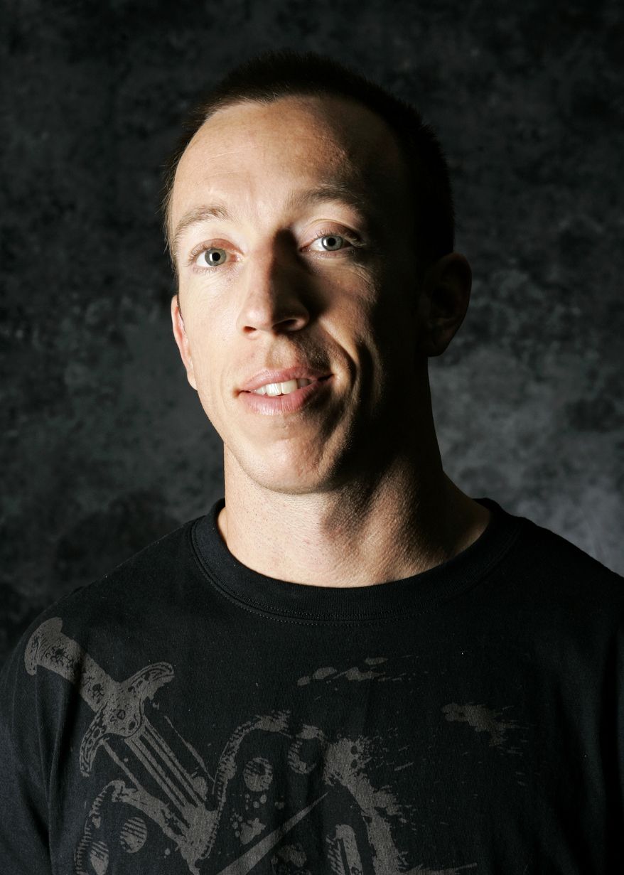 FILE - In this April 16, 2008, file photo, Olympic BMX cyclist Kyle Bennett poses for a portrait during the USOC Media Summit in Chicago. Bennett was killed in an automobile accident early Sunday, Oct. 14, 2012, in eastern Texas. He was 33. (AP Photo/Charles Rex Arbogast, File)