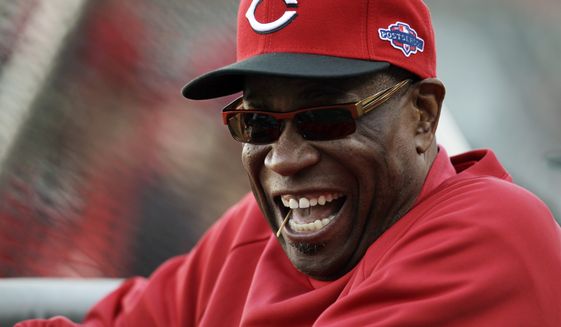 FILE - This Oct. 6, 2012 file photo shows Cincinnati Reds manager Dusty Baker laughing before Game 1 of the National League division baseball series between the San Francisco Giants and the Reds, in San Francisco. The Reds and Baker have agreed to a two-year contract extension. The Reds said a formal announcement will be made Monday afternoon, Oct. 15, 2012.The 63-year-old manager led the team to its second National League Central Division title in three seasons this year. He has been with the Reds five seasons. (AP Photo/Eric Risberg, File)