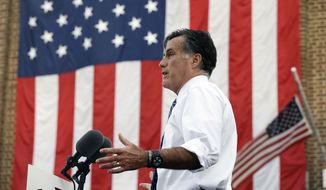 Republican presidential candidate and former Massachusetts Gov. Mitt Romney campaigns in front of The Golden Lamb Inn and Restaurant in Lebanon, Ohio, Saturday, Oct. 13, 2012. (AP Photo/Charles Dharapak)