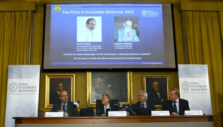 Per Krusell (from left), Staffan Normark, Peter Gardenfors and Tore Ellingsen of the Swedish Royal Academy of Sciences announce the winners of the Nobel Memorial Prize in Economic Sciences in Stockholm on Oct. 15, 2012. Americans Alvin E. Roth of Harvard University and Lloyd S. Shapley of University of California at Los Angeles were cited for "the theory of stable allocations and the practice of market design." (AP Photo/Scanpix Sweden, Henrik Montgomery)
